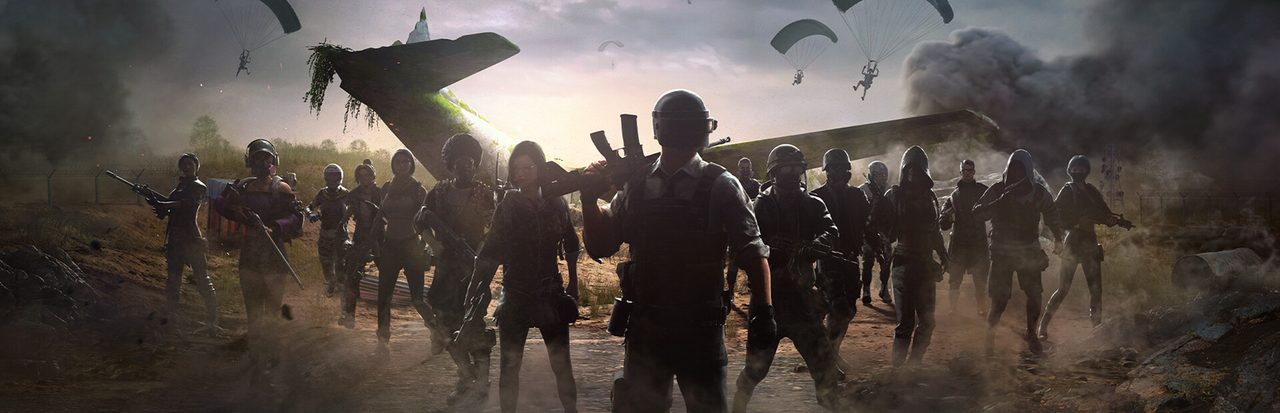 A large group of PUBG survivors in combat gear standing before a crashed cargo plane wing as more players parachute down in a smoky battlefield.
